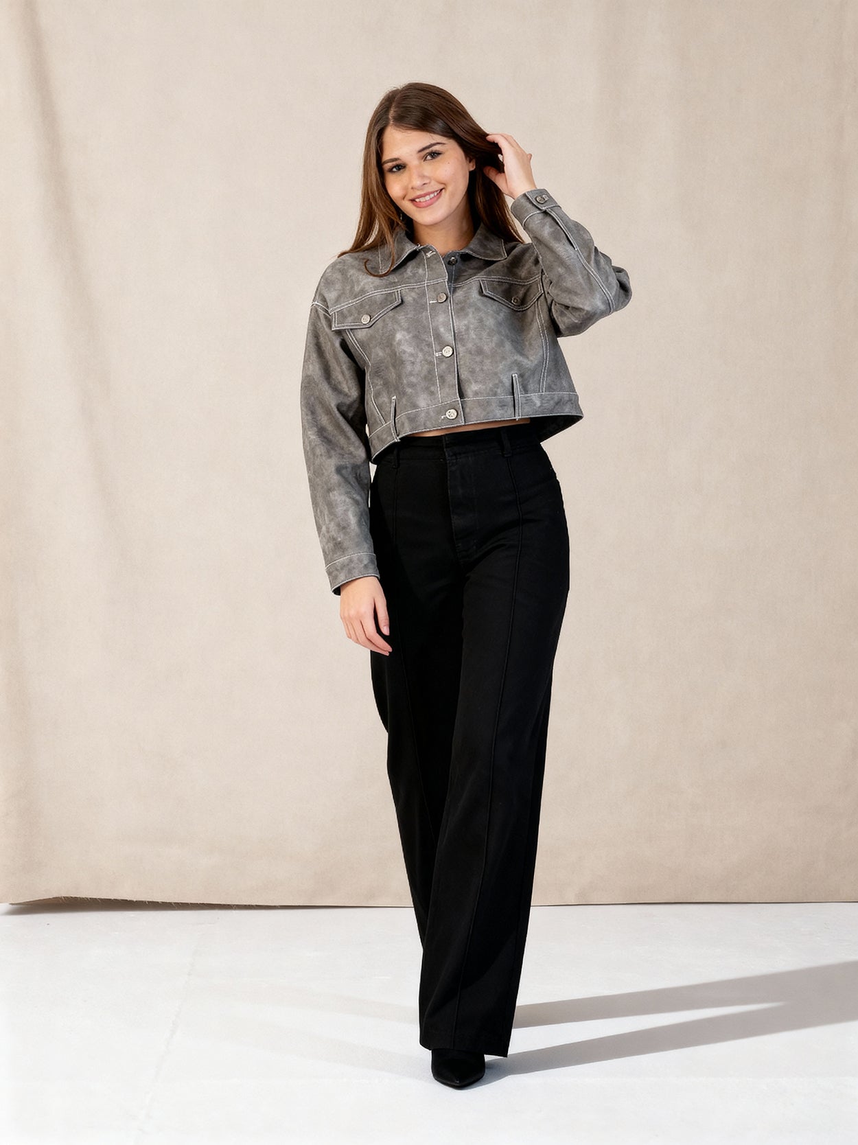 Leather jacket with a front button closure